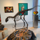 An Allosaurus skeleton and fossilized dinosaur eggs on display at Art Miami.